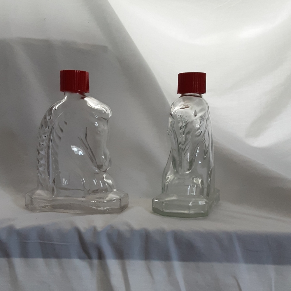 A pair of MacGregor cologne/after shave bottles
